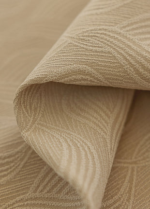 a close up view of a beige fabric