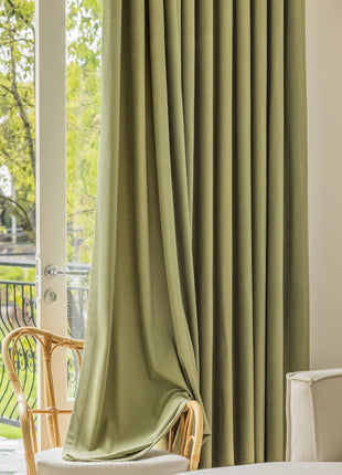 a living room filled with furniture and a large window