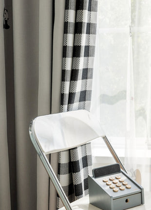 a desk with a phone and a window