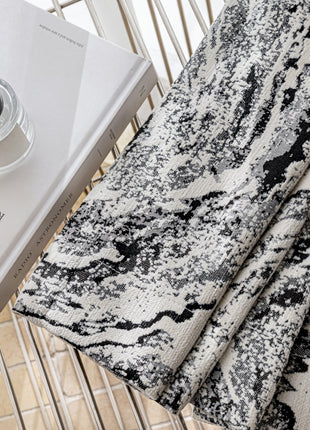 a book and a cup of coffee on a table