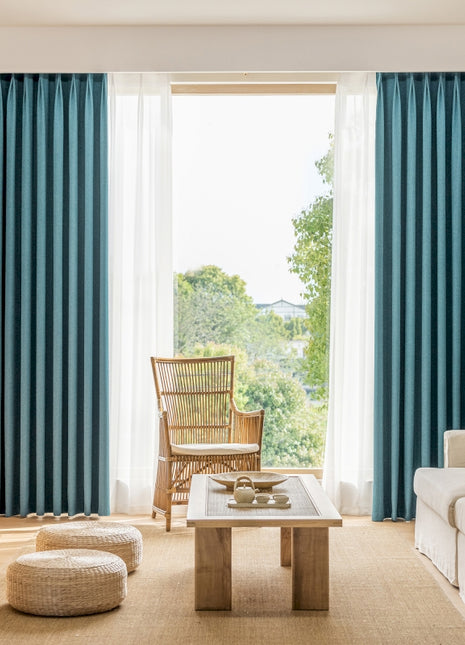 a living room filled with furniture and a large window