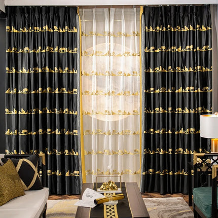 a living room with black and gold curtains