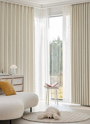 a living room with a white couch and a white rug