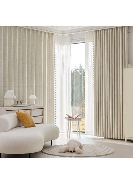 a living room with a white couch and a white rug