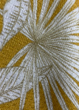 a close up of a yellow and white fabric