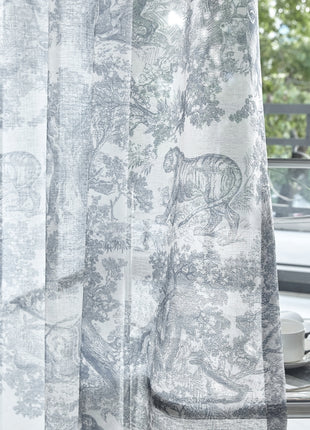 a close up of a curtain with a car in the background
