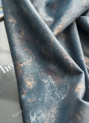 a book laying on top of a blue cloth