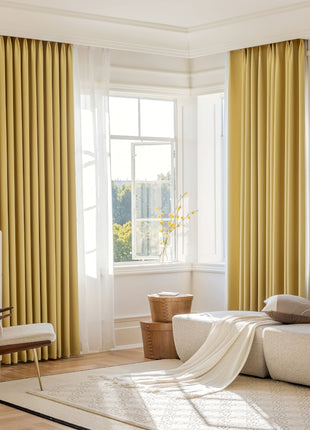 a living room filled with furniture and a large window