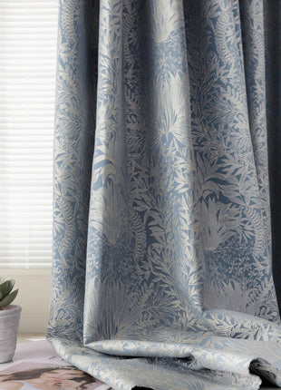 a curtain with a blue and white floral pattern