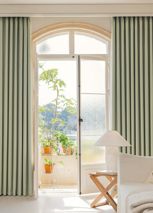 a living room filled with furniture and a large window