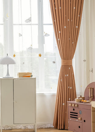 a child's room with pink furniture and curtains