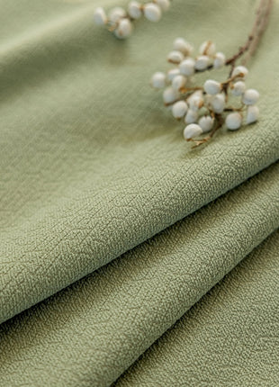a close up of a cloth with a flower on it