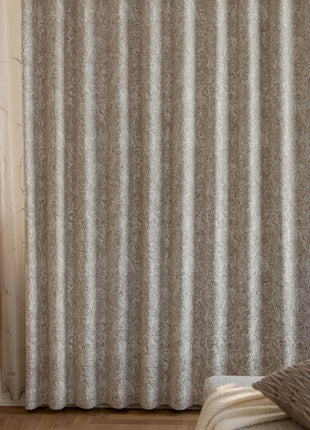 a bedroom scene with focus on the curtain