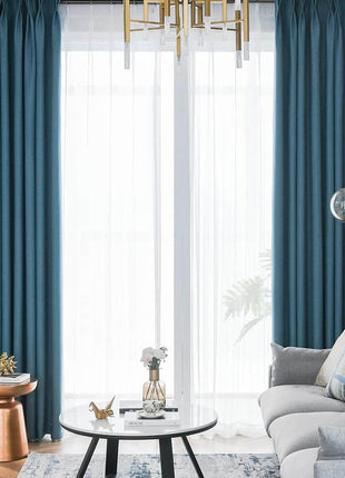 a living room filled with furniture and a chandelier