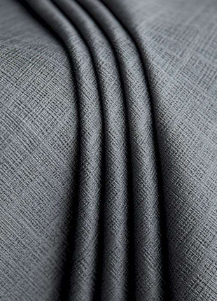 a close up shot of a grey fabric
