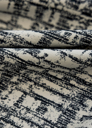 a close up of a black and white fabric
