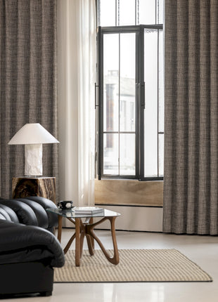 a living room filled with furniture and a large window