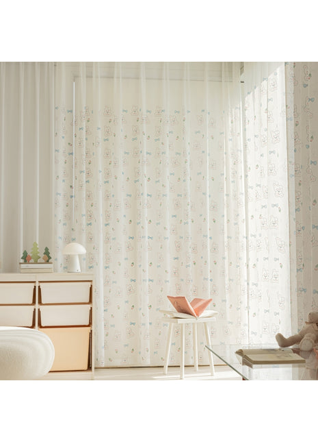 a room with a chair, dresser and a window