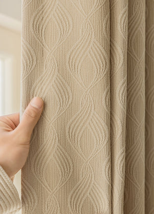 a person holding a curtain with their hand