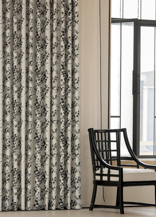 a chair sitting in front of a window next to a window