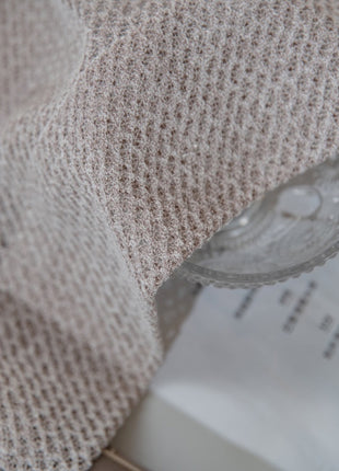 a glass of water sitting on top of a table
