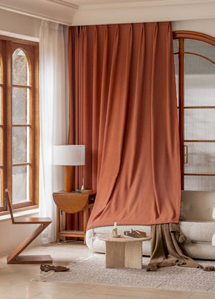 a living room filled with furniture and a large window