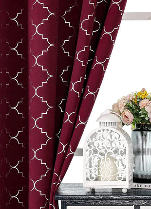 a vase of flowers sitting on a table next to a window