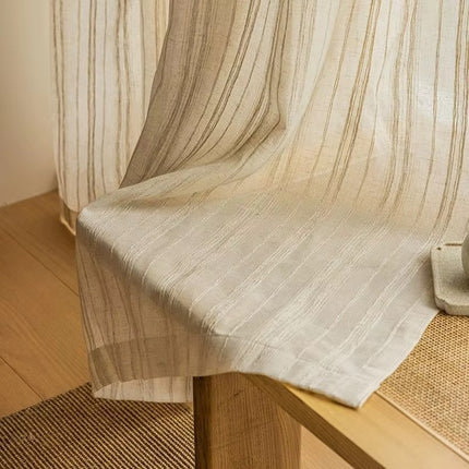 a close up of a wooden table with a curtain