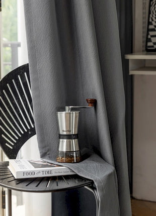 a table with a book and a salt shaker on it