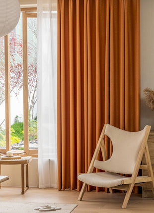 a living room filled with furniture and a large window