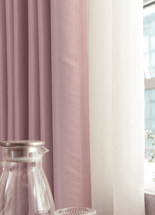 a vase of flowers sitting next to a window