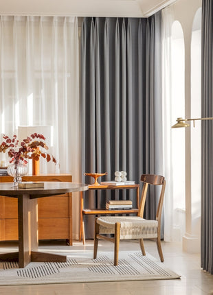 a living room with a table and chairs