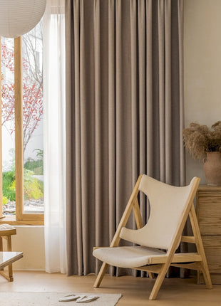 a living room with a chair and a table