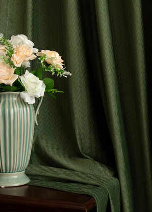 a vase filled with flowers sitting on top of a table