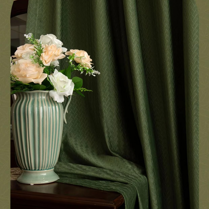 a vase filled with flowers sitting on top of a table