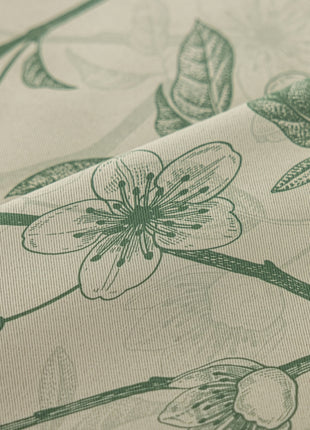 a close up of a flower on a sheet