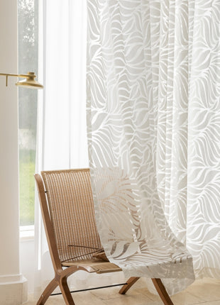 a chair sitting in front of a window