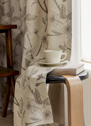 a table with a book and a cup on it