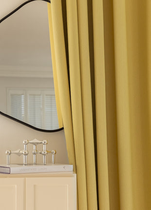 a mirror on a wall next to a dresser