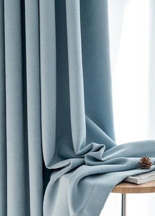 a table with a pair of pine cones on top of it