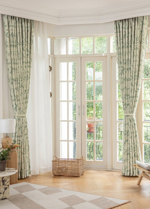 a living room filled with furniture and a large window