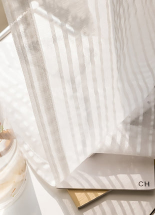 a vase with a plant inside of it on a table