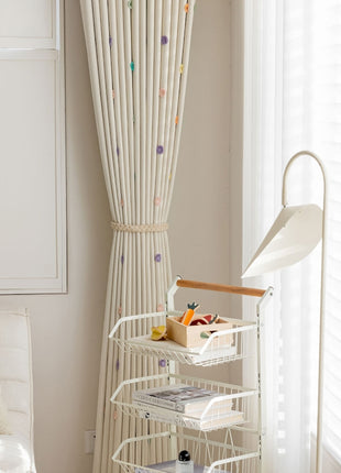 a bedroom with a white bed and white curtains