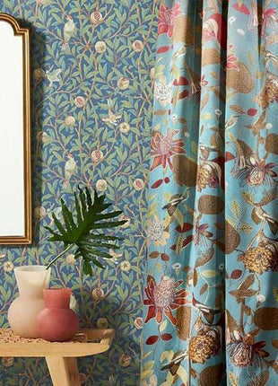 a mirror sitting on a table next to a window