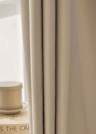 a stack of books sitting on top of a table next to a window