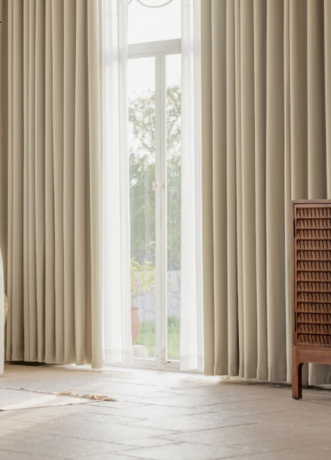 a living room with a white couch and a large window