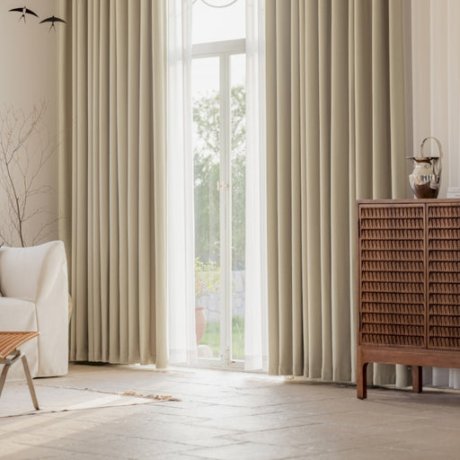 a living room with a white couch and a large window