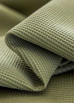 a close up view of a green fabric