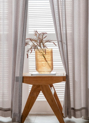 a wooden table with a vase on top of it