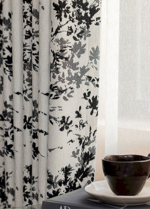 a cup and saucer sitting on top of a book